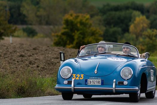 CAGLI , ITALY - OTT 24 - 2020 : PORSCHE 356 1500 SPEEDSTER 1955 on an old racing car in rally Mille Miglia 2020 the famous italian historical race (1927-1957