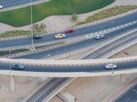 Part of a road junction from a height with road traffic in Dubai