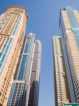 High-rise skyscrapers with blue sky of Dubai city. UAE