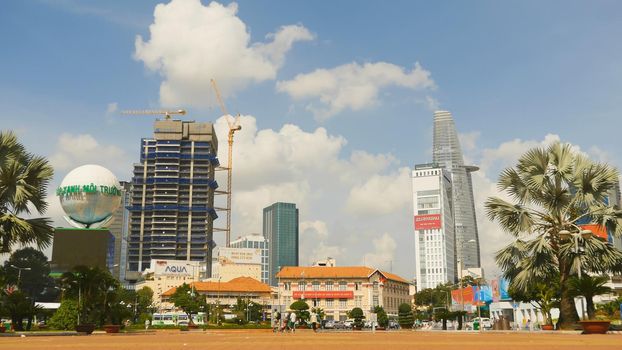 SAIGON, VIETNAM - OCTOBER 12, 2016: The area in Ho Chi Minh City. Skyscrapers, cars and people