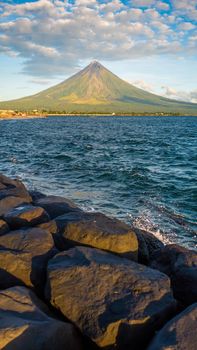 Mayon Volcano is an active stratovolcano in the province of Albay in Bicol Region, on the island of Luzon in the Philippines. Renowned as the perfect cone because of its symmetric conical shape