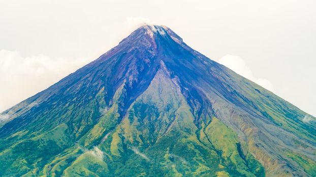 Mayon Volcano is an active stratovolcano in the province of Albay in Bicol Region, on the island of Luzon in the Philippines. Renowned as the perfect cone because of its symmetric conical shape