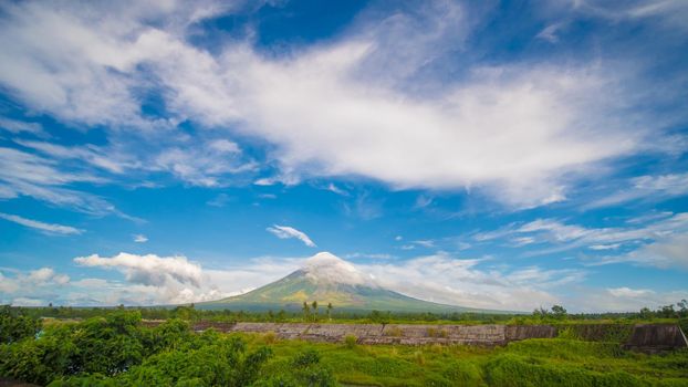 Mayon Volcano is an active stratovolcano in the province of Albay in Bicol Region, on the island of Luzon in the Philippines. Renowned as the perfect cone because of its symmetric conical shape