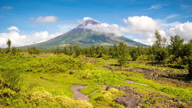 Mayon Volcano is an active stratovolcano in the province of Albay in Bicol Region, on the island of Luzon in the Philippines. Renowned as the perfect cone because of its symmetric conical shape