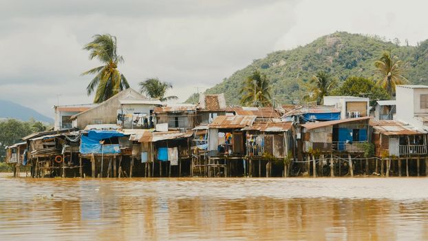 Slums in Nha Trang. Houses on the river. Vietnam