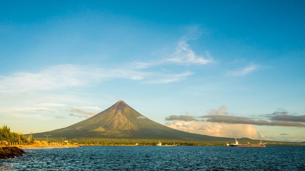 Mayon Volcano is an active stratovolcano in the province of Albay in Bicol Region, on the island of Luzon in the Philippines. Renowned as the perfect cone because of its symmetric conical shape