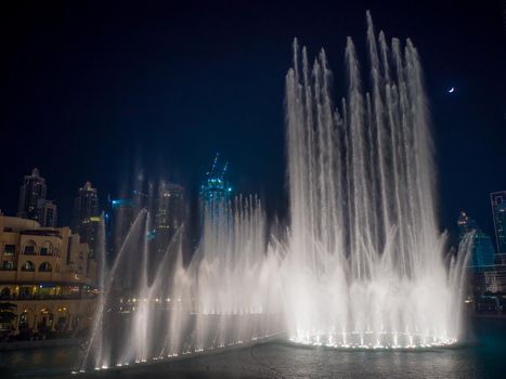 Dancing fountain with lighting in the city at night