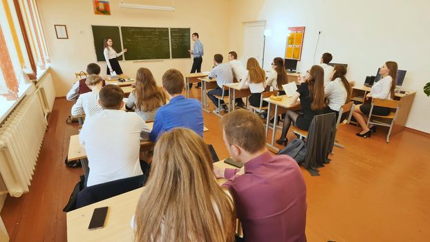 Students in the classroom are at their desks. Russian school