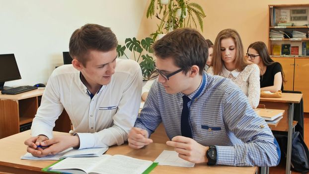 Students study in the classroom at the school desk.