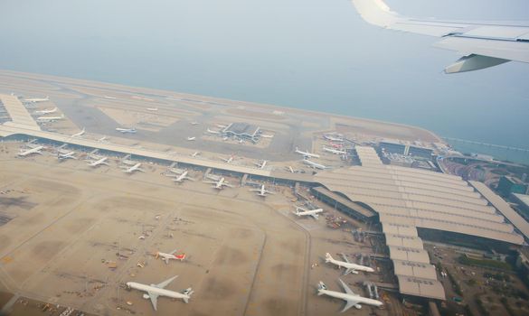 Aerial photography of the international airport with airplanes parking. Hong Kong International Airport