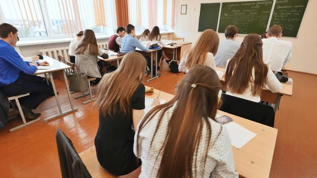 Students in the classroom are at their desks. Russian school