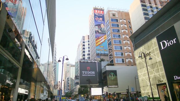 Central streets of Hong Kong. Billboards. Shopping centers and fashion shops. High-rise architectural infrastructure. Hotels. Places of entertainment and recreation