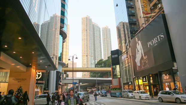 Central streets of Hong Kong. Billboards. Shopping centers and fashion shops. High-rise architectural infrastructure. Hotels. Places of entertainment and recreation