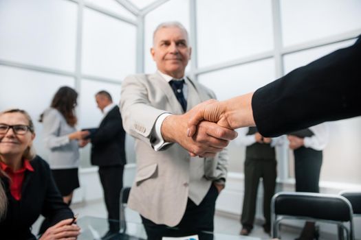 businessman confidently shaking hands with his business partner. the concept of cooperation