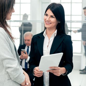 business colleagues discussing business documents standing in the office. business concept