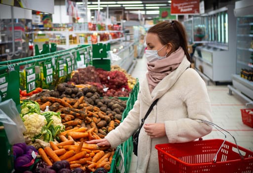 girl in a mask, buying groceries at the supermarket. Isolated Covid-19 pandemic.