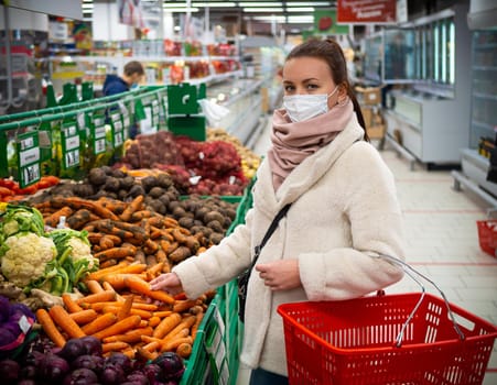 girl in a mask, buying groceries at the supermarket. Isolated Covid-19 pandemic.