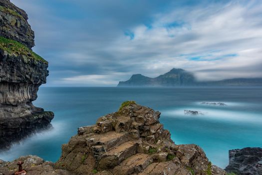 Dramatic ultra long exposure of viewpoint over the ocean in Faroe Islands