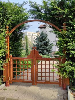 light decorative wooden gate in the park close up