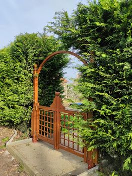 light decorative wooden gate in the park close up