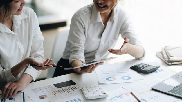 Business team analyzing income charts and graphs with modern laptop computer. Close up.Business analysis and strategy concept..