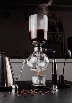 Syphon alternative method of making coffee. coffeemaker is a manual pour-over style glass. Cofee brewing