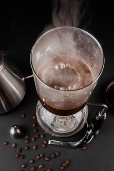 Syphon alternative method of making coffee. coffeemaker is a manual pour-over style glass. Cofee brewing