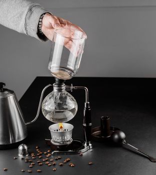 Syphon alternative method of making coffee. coffeemaker is a manual pour-over style glass. Cofee brewing