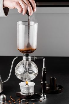 Syphon alternative method of making coffee. coffeemaker is a manual pour-over style glass. Cofee brewing