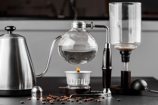 Syphon alternative method of making coffee. coffeemaker is a manual pour-over style glass. Cofee brewing