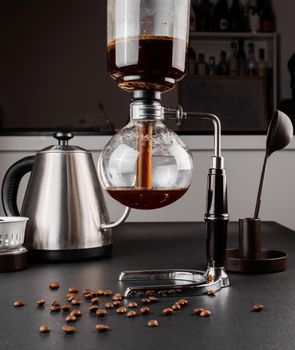 Syphon alternative method of making coffee. coffeemaker is a manual pour-over style glass. Cofee brewing