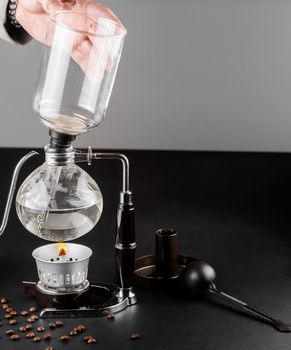 Syphon alternative method of making coffee. coffeemaker is a manual pour-over style glass. Cofee brewing