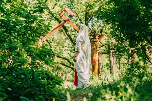 happy woman pagan priestess prepared for the ceremony. old faith in our time. seasons, summer