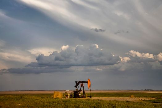 Prairie Storm Clouds Saskatchewan oil pump jack