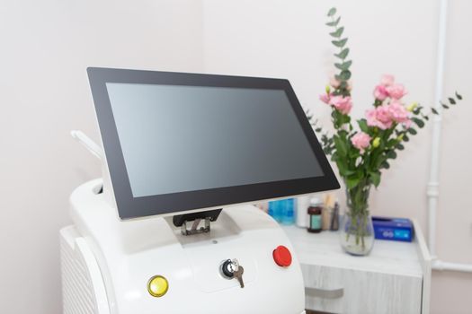 Professional laser hair removal machine, screen for setting up the hair removal process. Professional cosmetology, body epilation. Body care concept