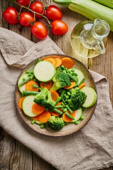 Mix of boiled vegetables, steam vegetables for dietary low-calorie diet. Broccoli, carrots, cauliflower, top view.