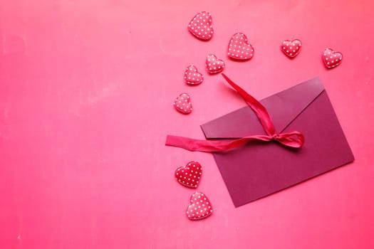 Love letter and heart shape symbol red background .