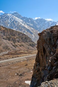 Early spring in the mountains. Travel by car in Georgia. Amazing mountain cliffs landscape.