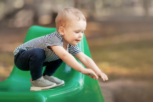 Little boy sports training her balance on chair edge