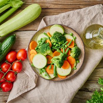 Mix of boiled vegetables, steam vegetables for dietary low-calorie diet. Broccoli, carrots, cauliflower, top view.