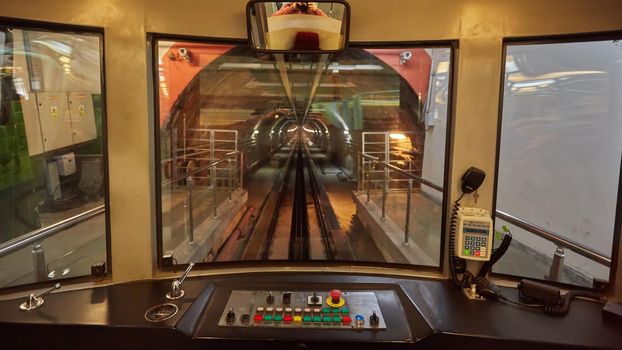 View of the driver cabin of an empty tram.
