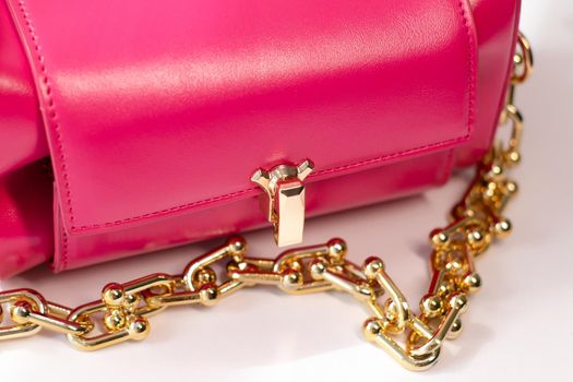 pink little handbag with gold chain isolated on white background. Product photography. bags and purses.