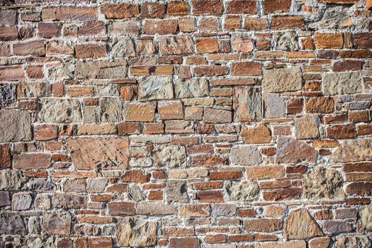 Background.Stone wall of rough unprocessed stones.