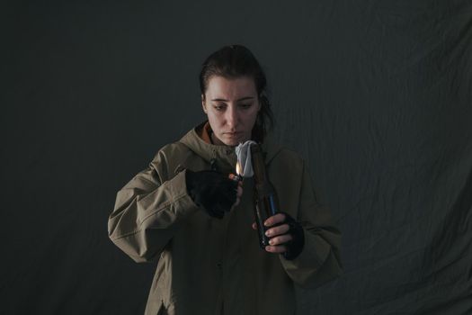 Ukrainian woman with molotov standing for her country