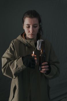 Ukrainian woman with molotov standing for her country