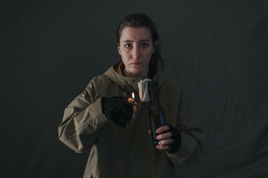 Ukrainian woman with molotov standing for her country