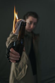 Ukrainian woman with molotov standing for her country