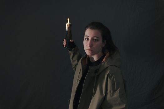 Ukrainian woman with molotov standing for her country