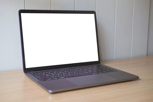 Computer mockup white background on table. Laptop with blank screen.