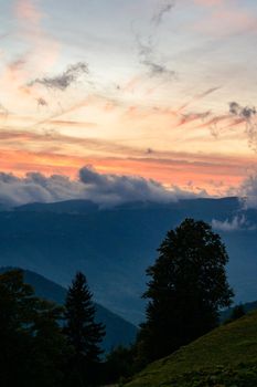 Dawn in the mountains, clouds covered the slopes of the Carpathians, a tourist trip to the Carpathians.